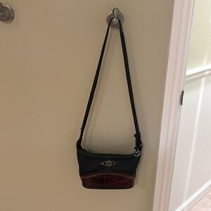 Brighton woman's leather purse. The leather are brown and black